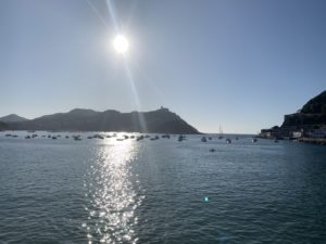 Looking out to sea in the evening. Monte Igueldo, with Isla de Santa Clara in foreground.