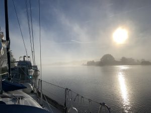 Sunrise over a misty river